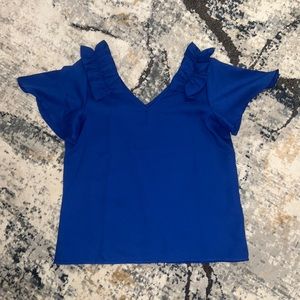 blue ruffled top